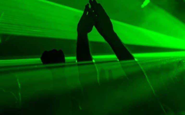 hands in the air at 1990 rave with lasers